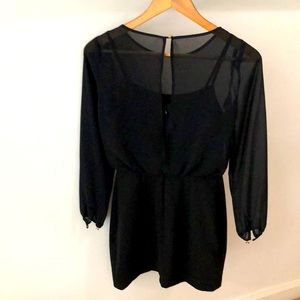 Black dress perfect for any occasion. Sheer with a built in tank top. New!